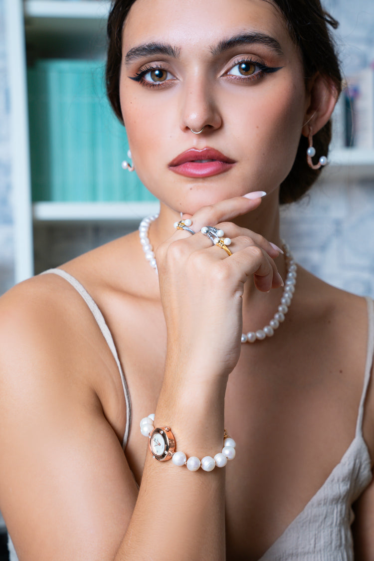 Woman elegant wearing Freshwater pearls earrings, bracelet Pearl Watch, earrings sterling silver pearls and pearl stainless pearl rings